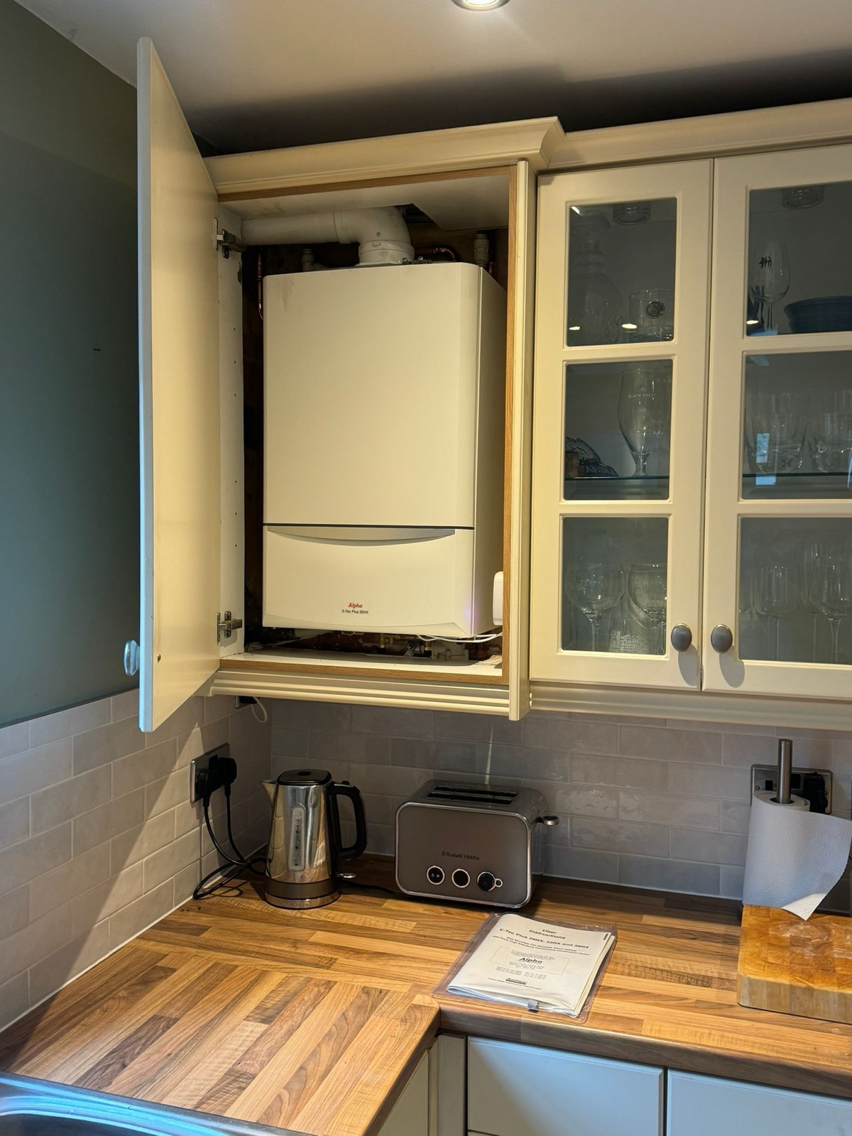 New Alpha E-Tec Plus combi boiler installed in a kitchen cupboard in Hale