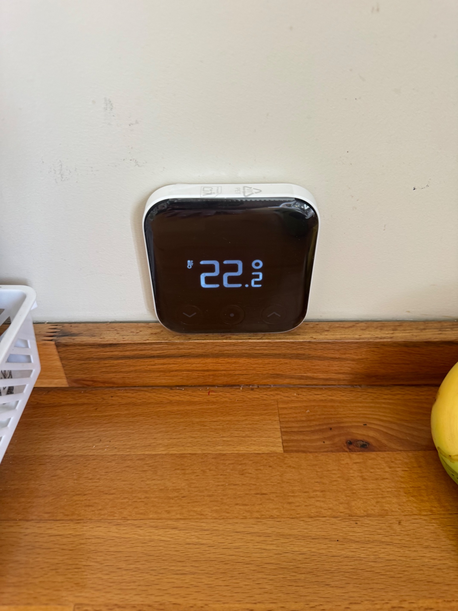 tado X smart thermostat installed on the wall of a home in Lowton, Warrington, showing the room temperature